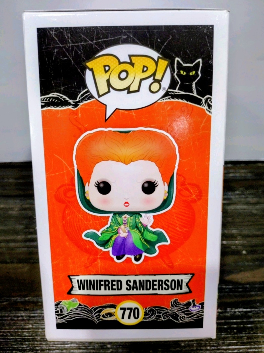 Boxed Funko Pop vinyl figure of Winifred Sanderson with orange hair, green outfit, purple details