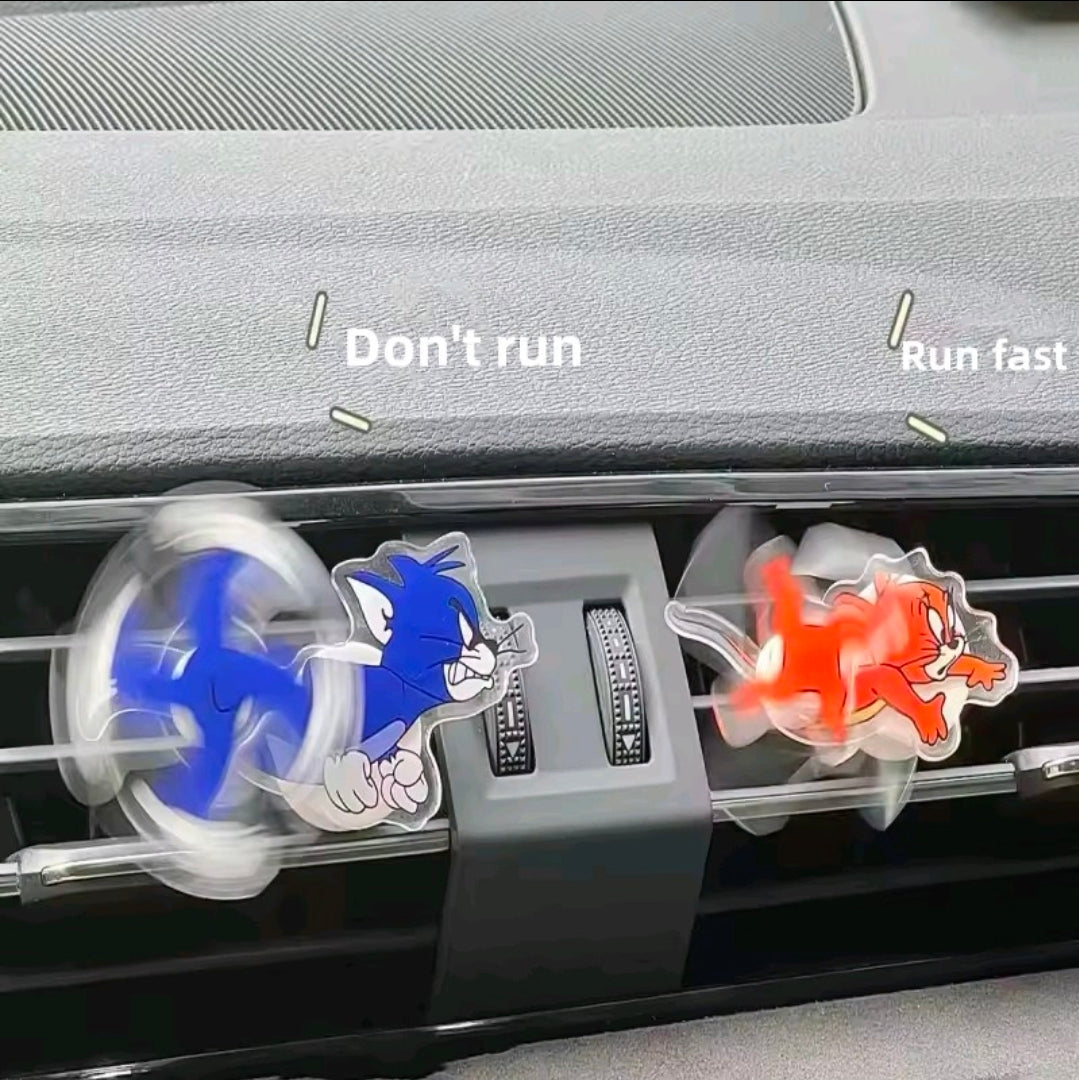 Blue and orange cartoon cat acrylic air-vent spinner clips on center vent.