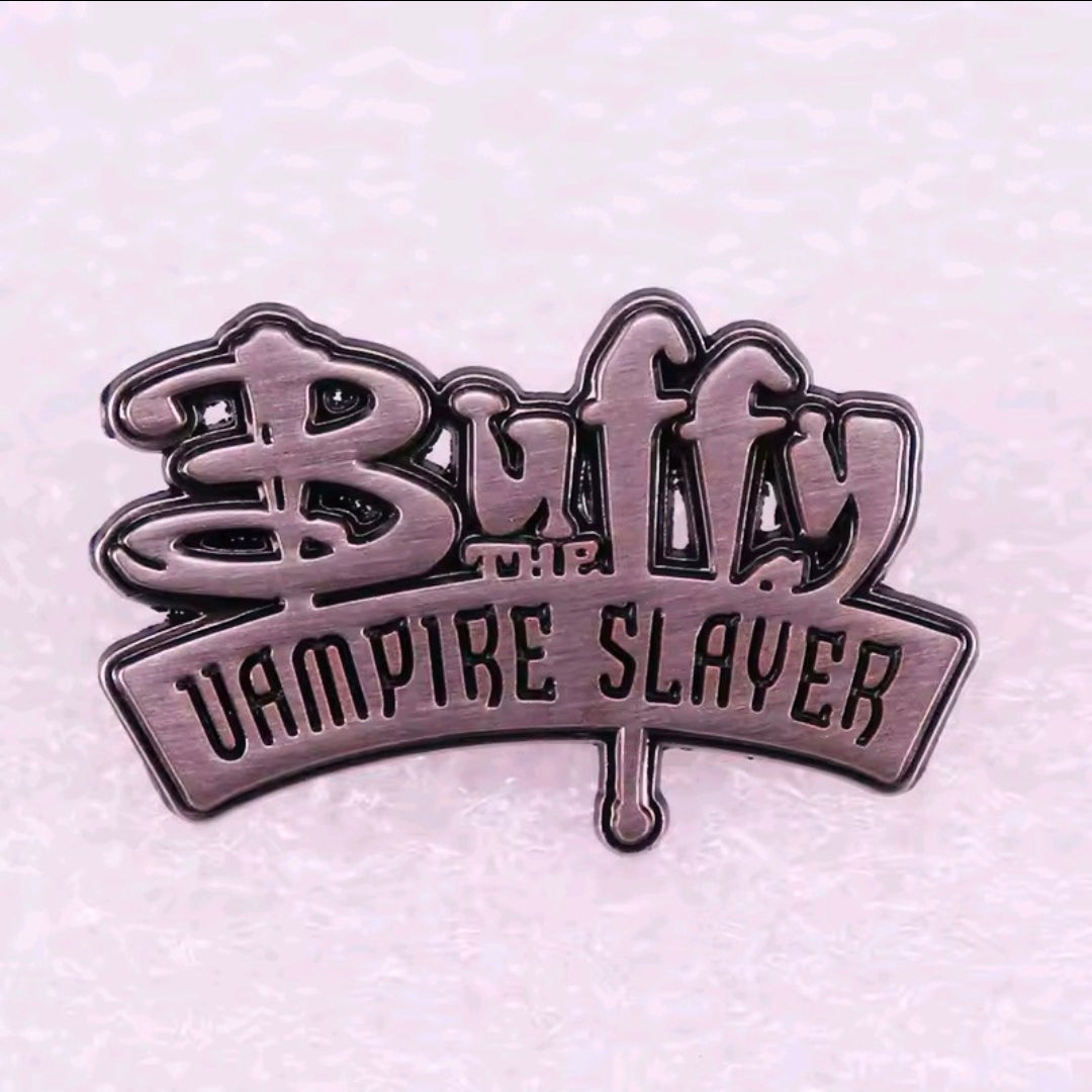 Buffy Vampire Slayer logo enamel lapel pin with “Dampire Slayer” text, silver-tone