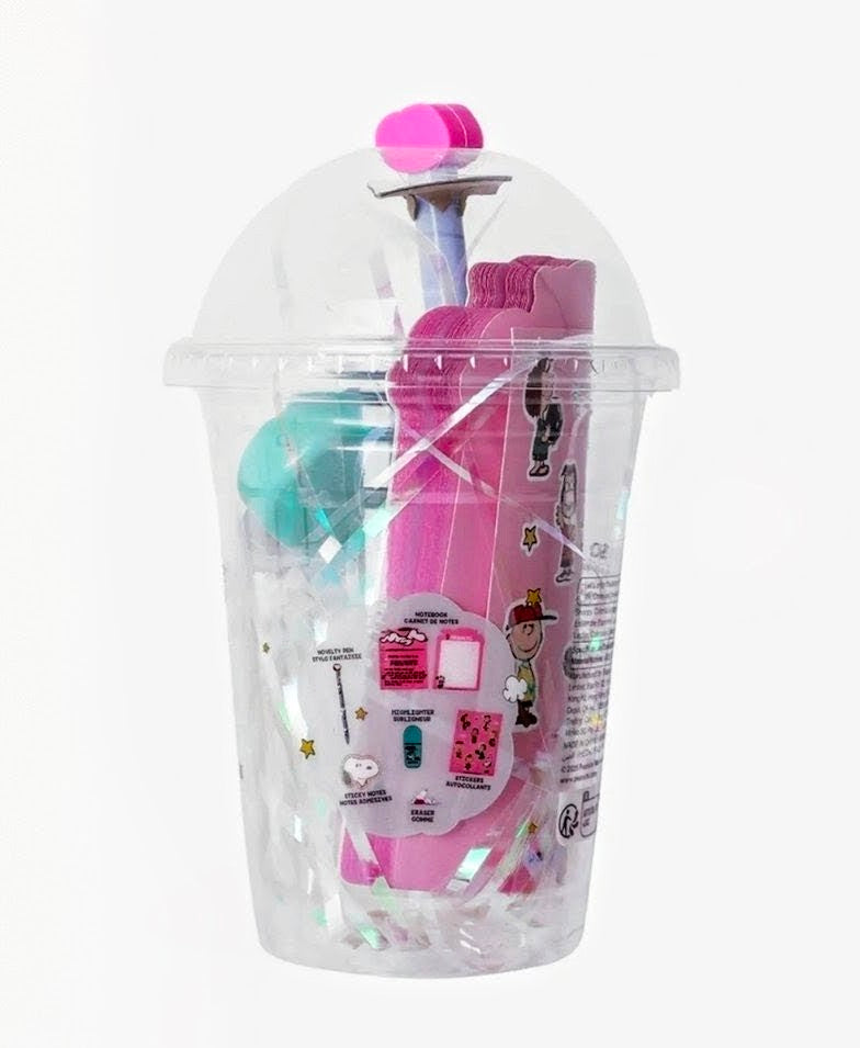Clear plastic Snoopy stationery cup set with pink and blue items inside and lid.
