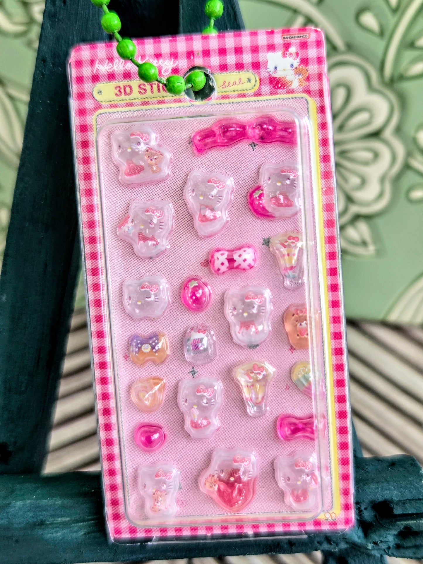 Pink gingham blister pack of 3D character stickers on a keychain