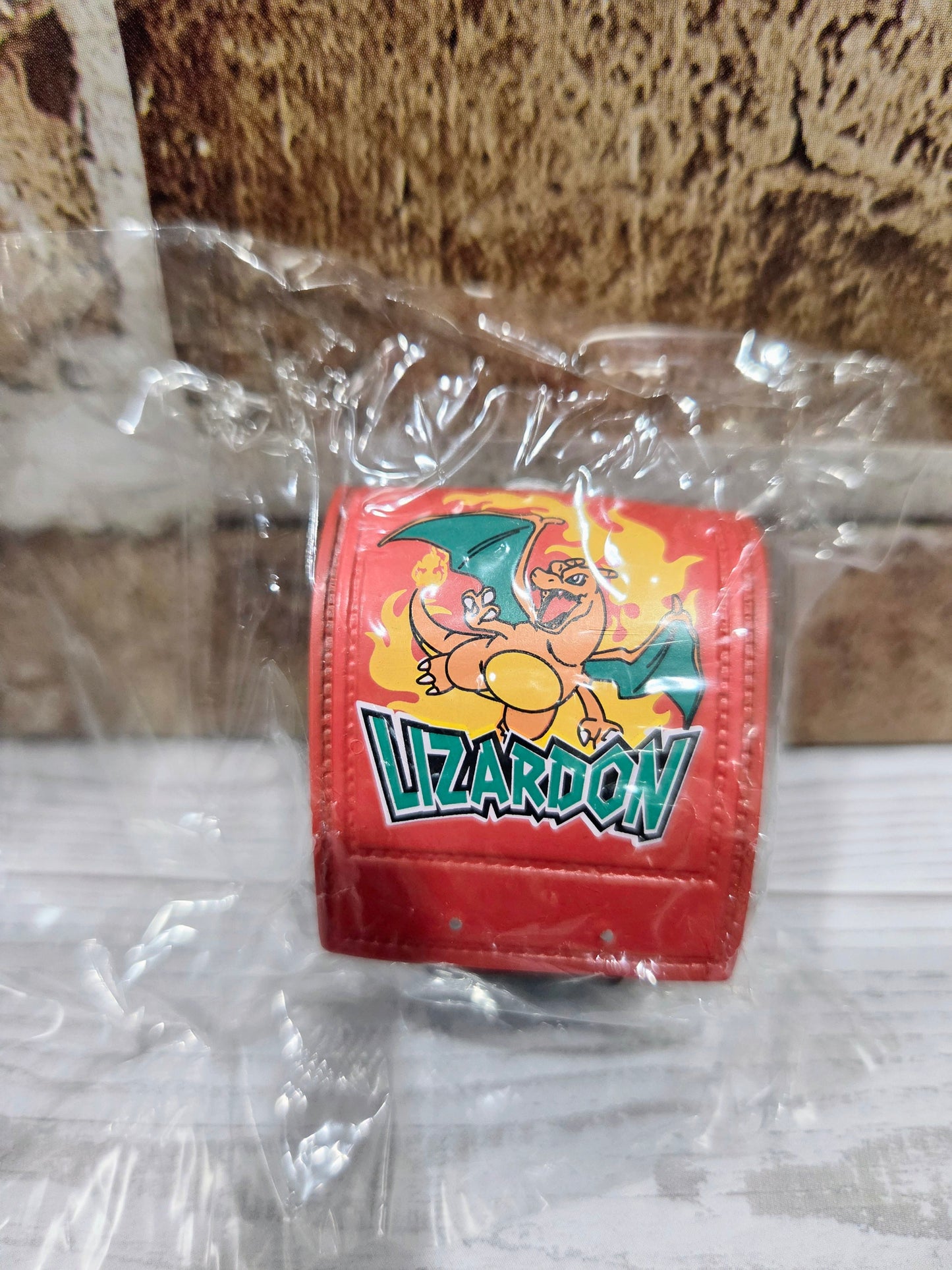 Red Charizard-themed mini school bag figure in clear plastic wrap
