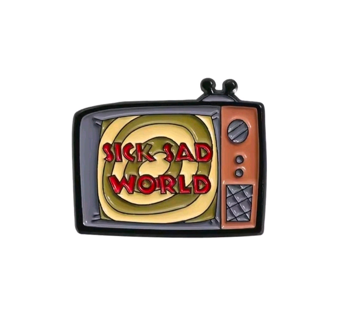 Enamel TV screen pin reading 'Sick Sad World' with orange TV frame.