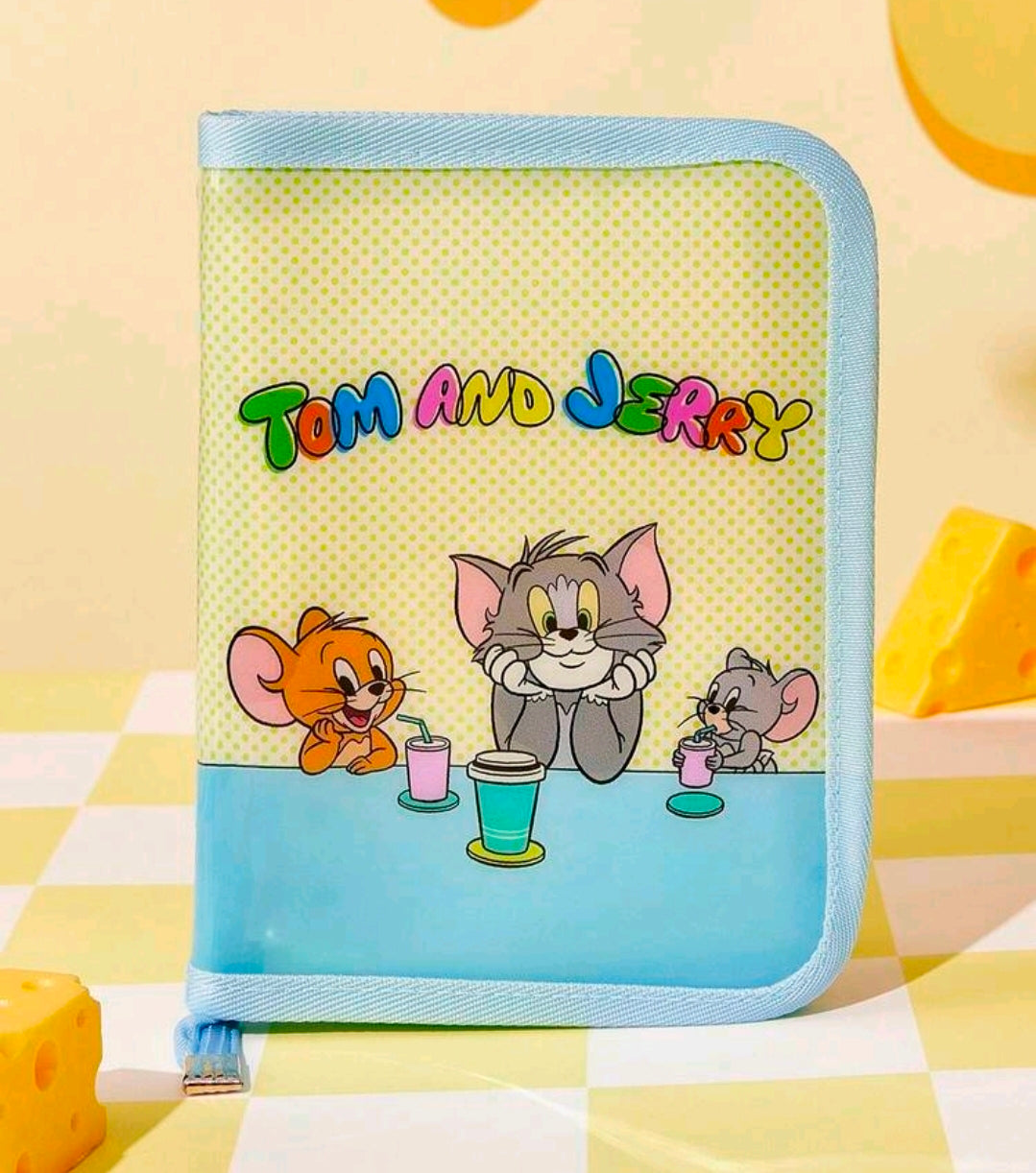 Light blue zipper planner binder with Tom and Jerry character scene on the front.