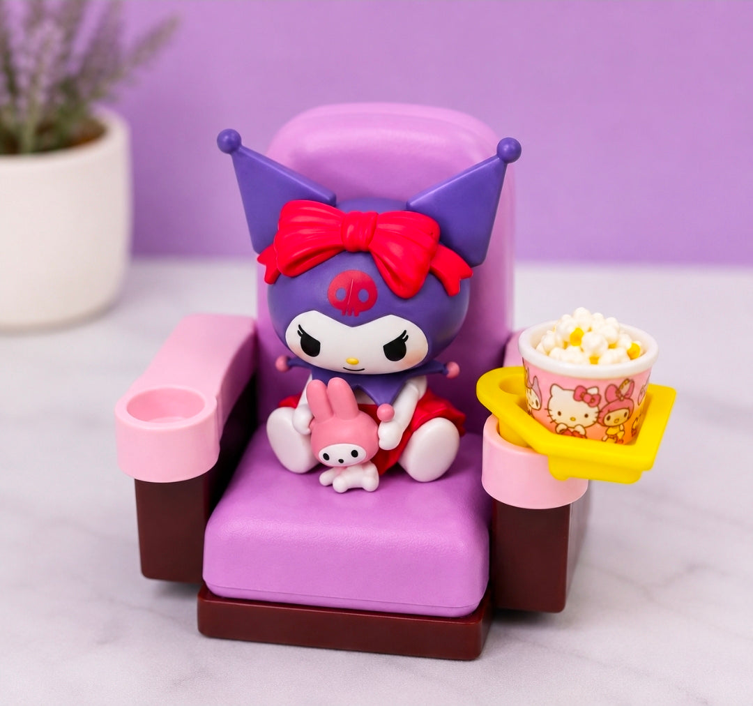 Mini character figure in a purple theater chair with red bow and snack tray