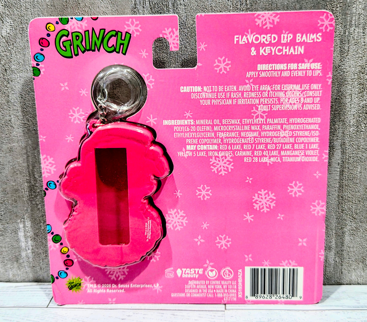 Flavored lip balm set front card with pink keychain holder and Grinch charm
