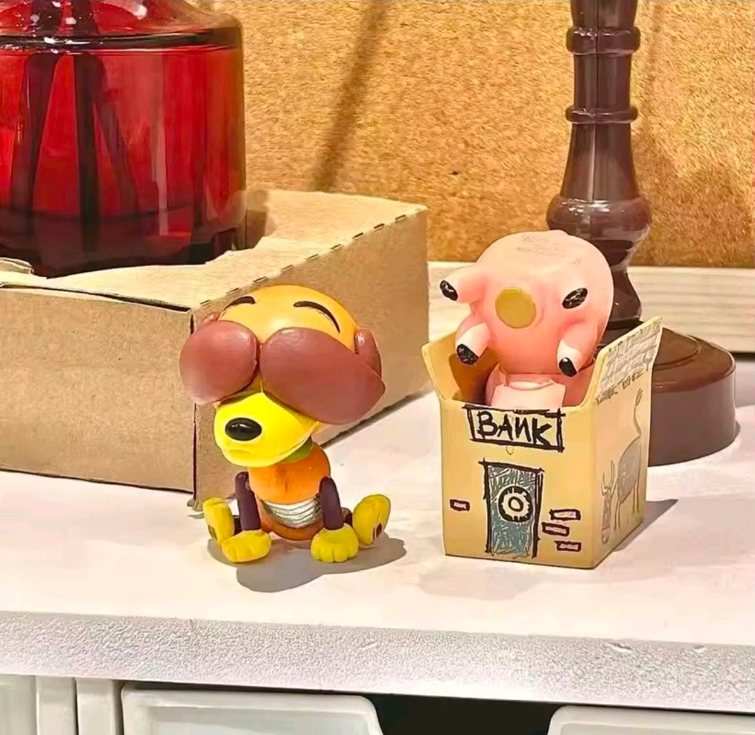 Two mini Toy Story gashapon figures with character boxes, posed on a display shelf