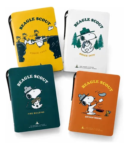 Four Beagle Scout pocket field notebooks with faux leather covers in yellow, white, teal, and orange