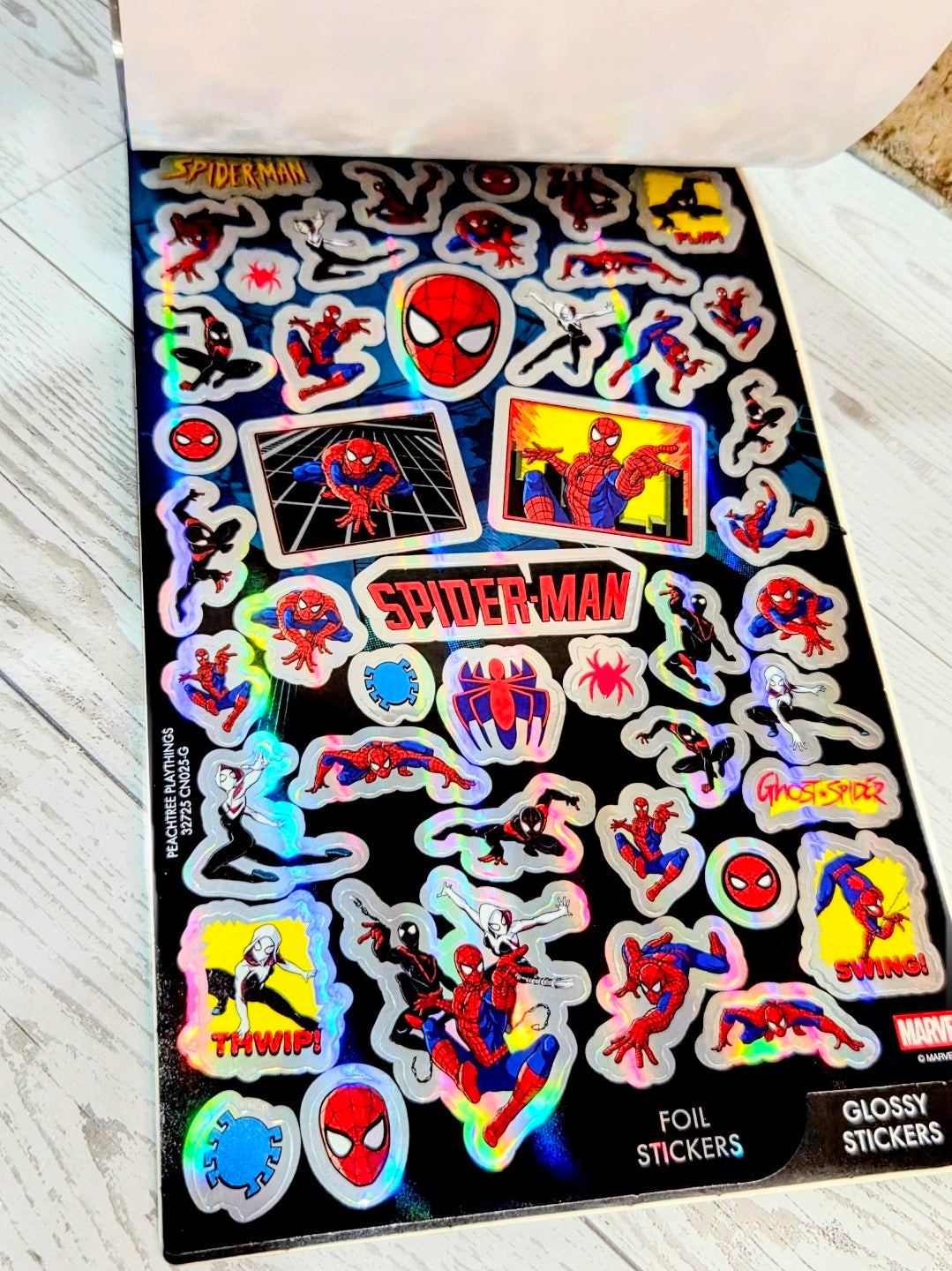 Spider-Man sticker sheet with foil, glitter, glossy, and puffy sticker designs