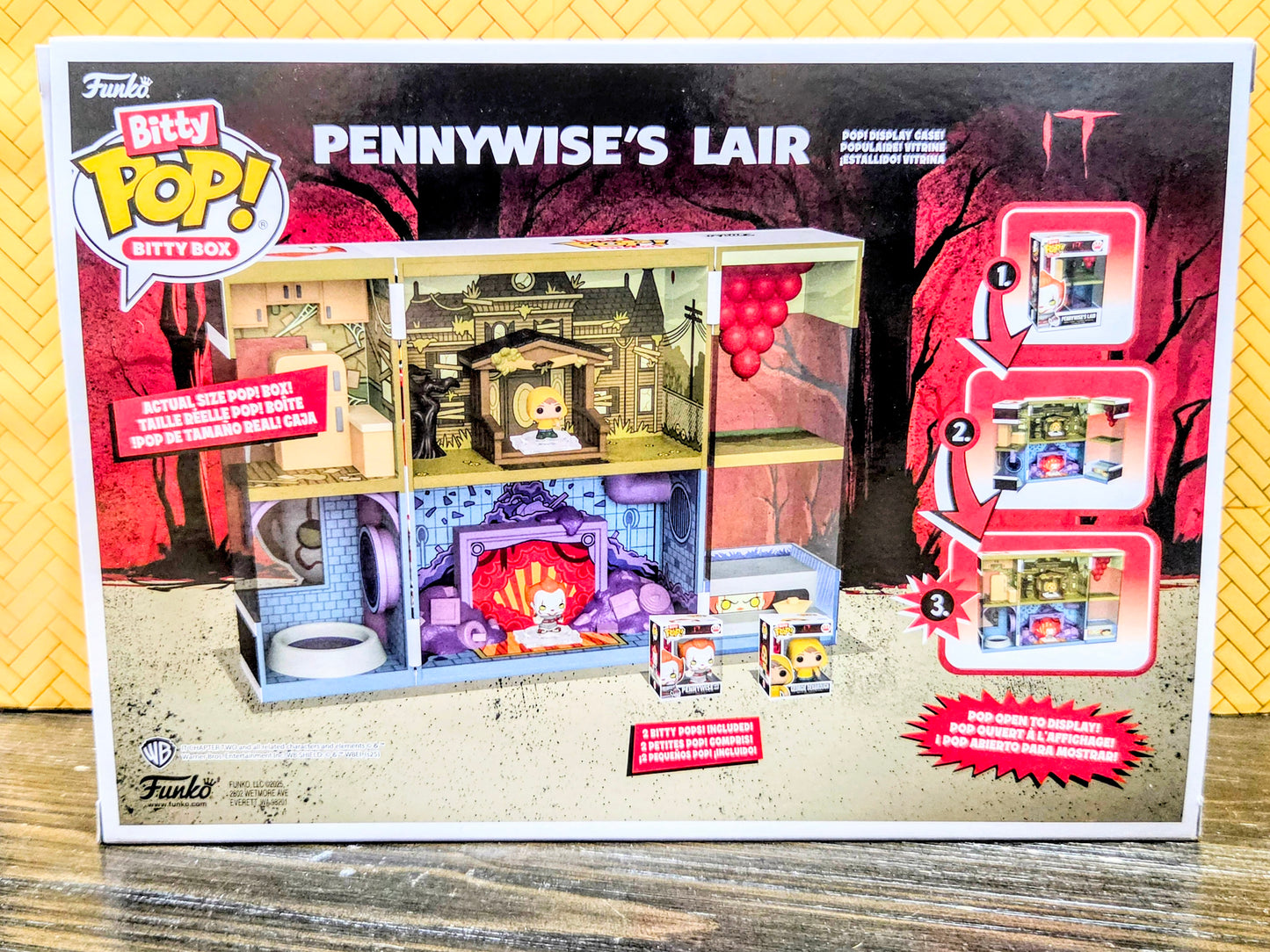 Funko Bitty Pop! dollhouse box front with interior scene and numbered opening arrows
