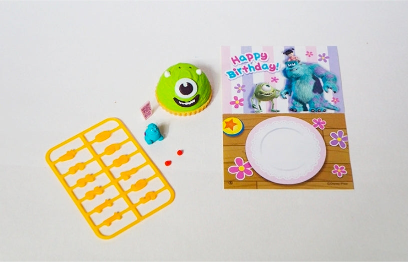 Birthday cake gift set with green cupcake toy, Mike and Sulley figures, tray, and card