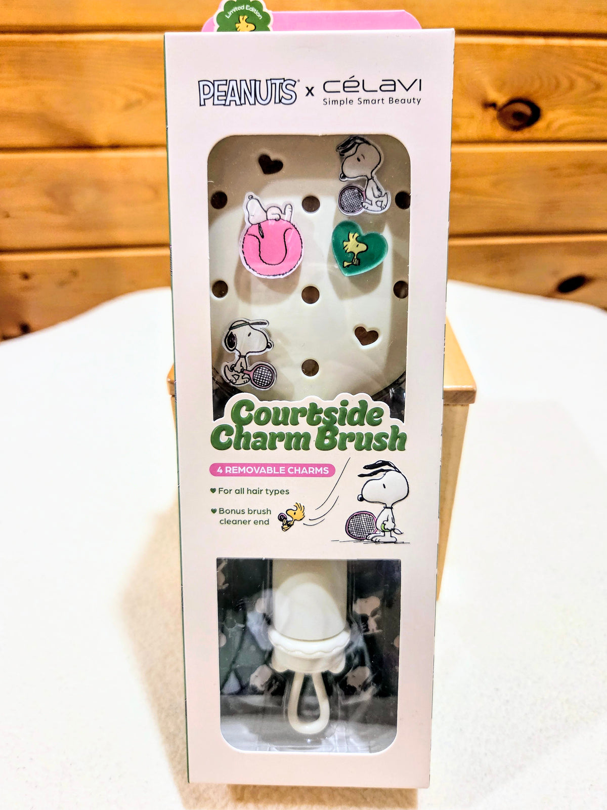 Courtside Charm Brush gift set box front with charm layout and lower mask tray