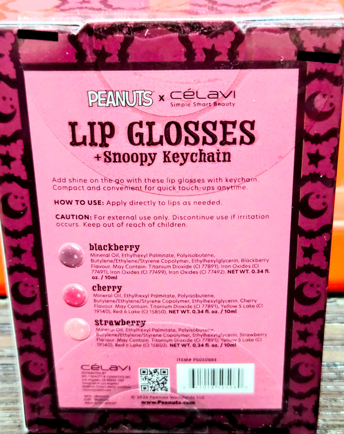Lip gloss + Snoopy keychain box back with ingredient list and shade names