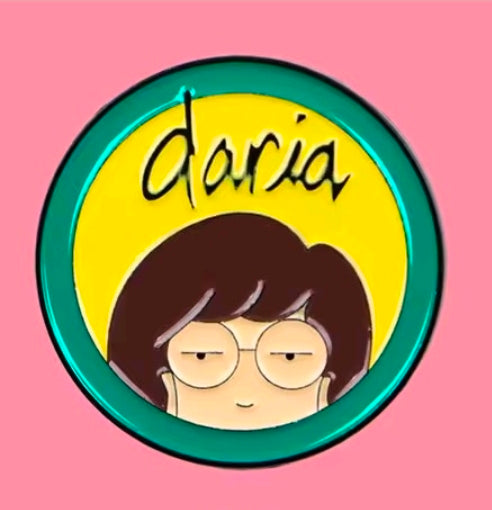 Daria character circle enamel pin with green rim and yellow background