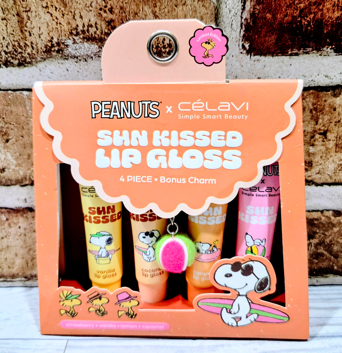 Sun kissed lip gloss set, gift box front with Snoopy charm pom-pom