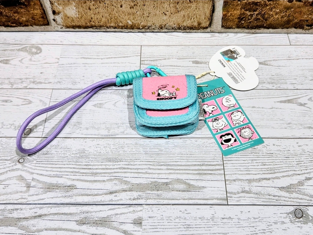 Colorful canvas earbud case with wrist strap, teal and pink, carabiner and tags