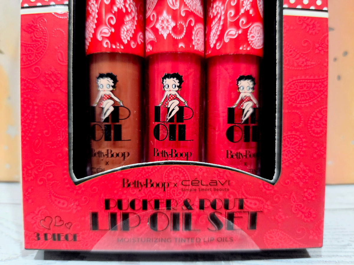 Celavi Betty Boop tinted lip oil set, three red tubes in black display tray