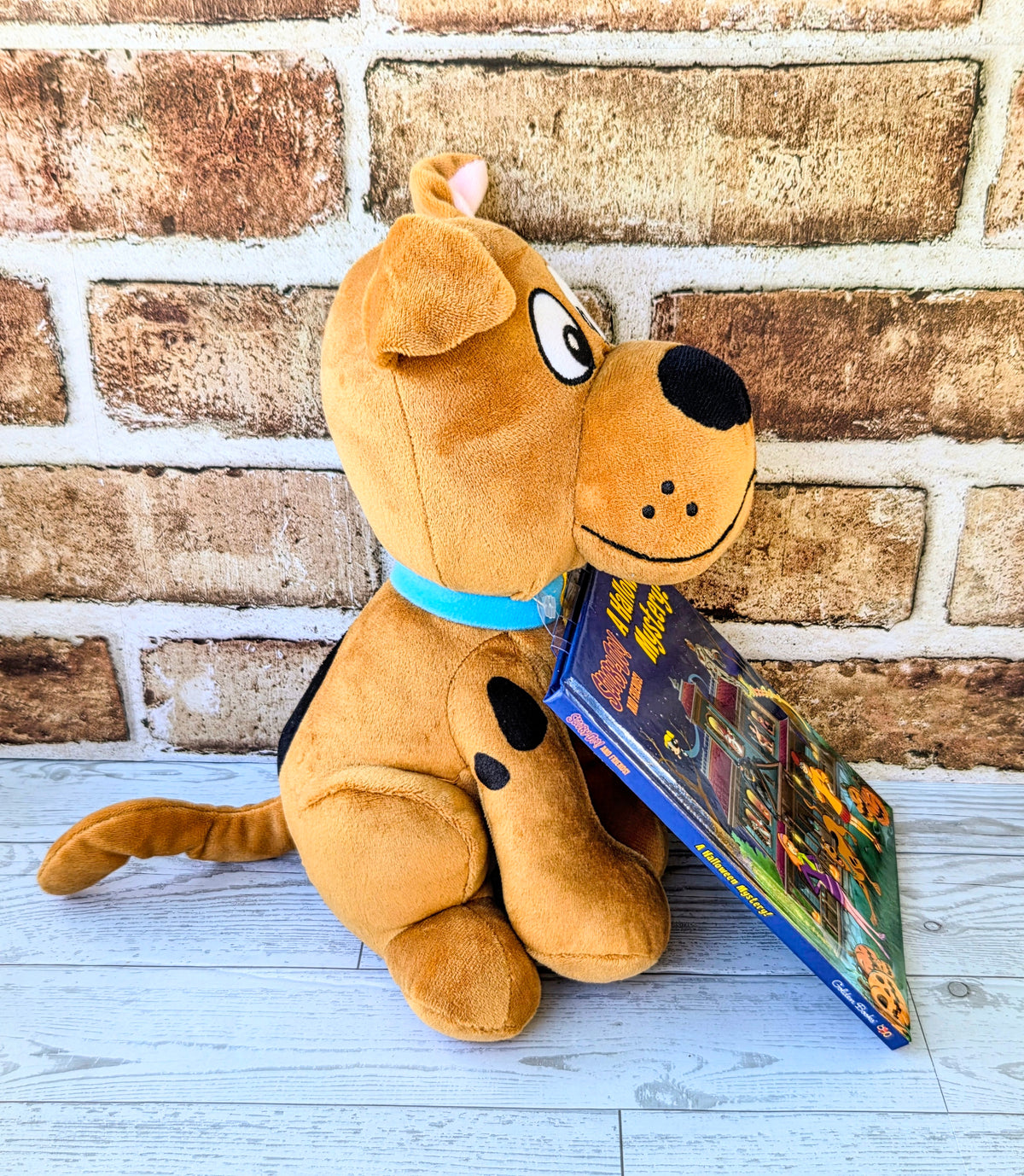 Orange Scooby-Doo plush with a Halloween mystery hardcover book