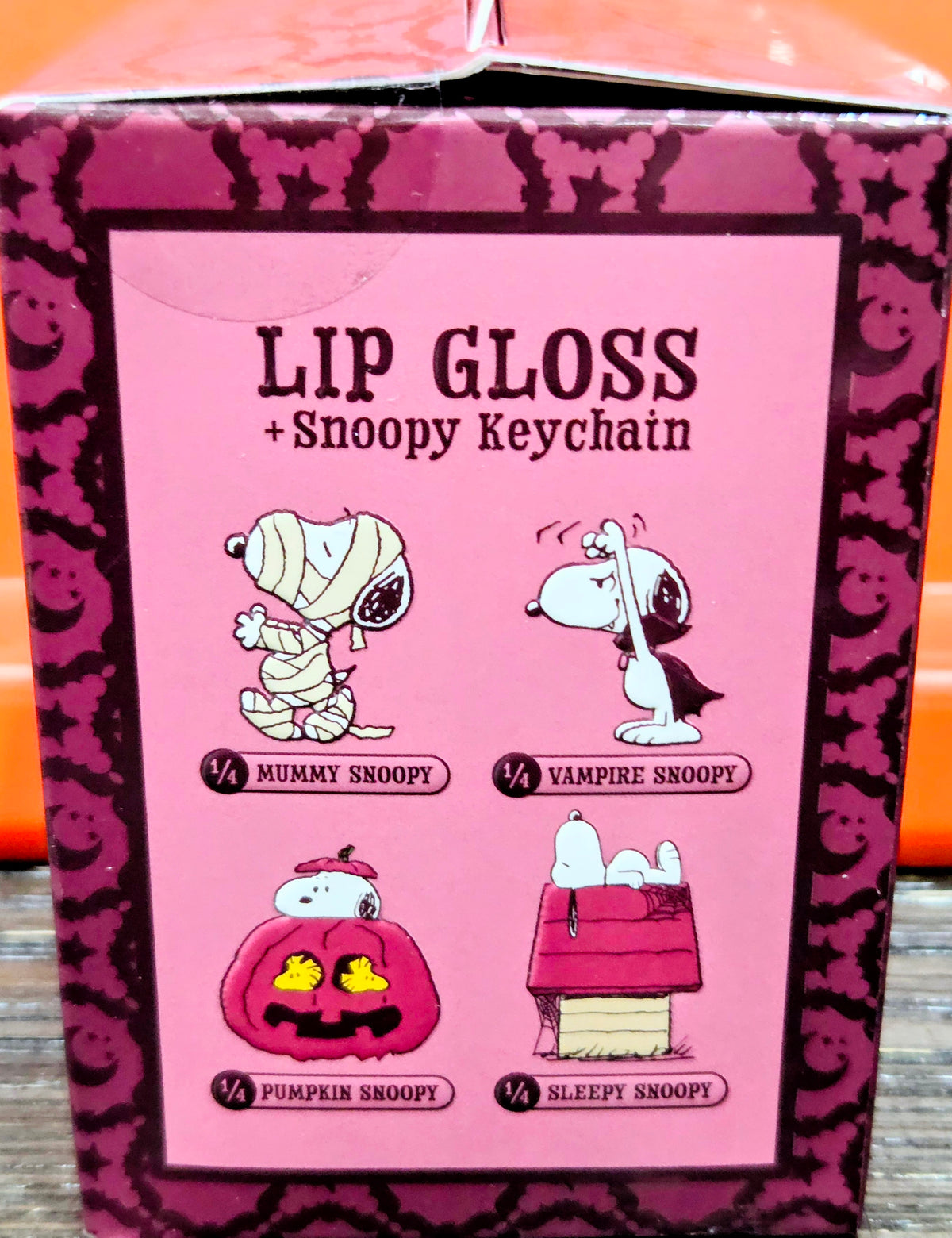 Lip gloss + Snoopy keychain box front with character scene icons