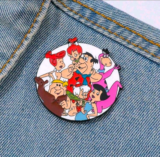 Round enamel pin brooch featuring The Flintstones family cartoon scene in a circle frame