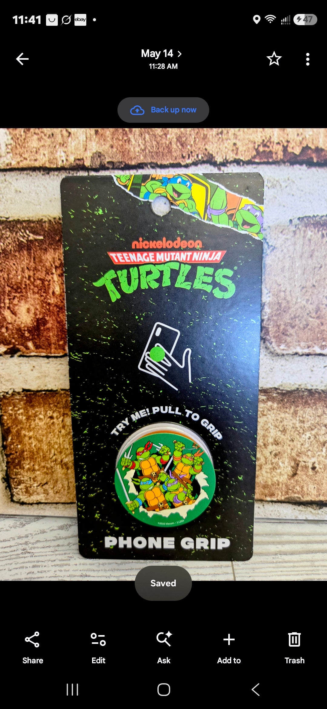 TMNT phone grip holder with colorful Turtles graphic, round grip pad