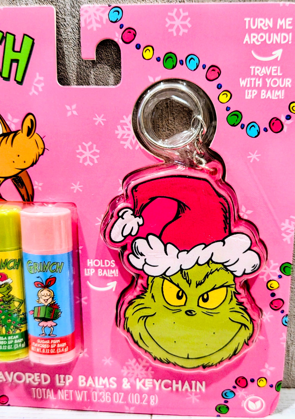 Flavored lip balm set front card with pink keychain holder and Grinch face charm