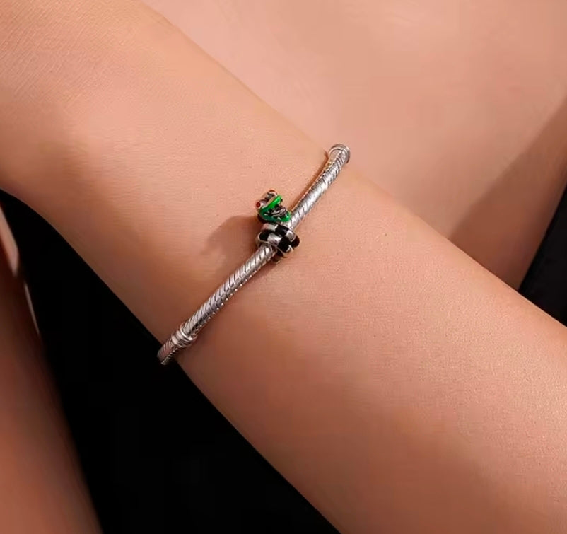 S925 sterling silver charm on snake-chain bracelet with green enamel head and red teeth