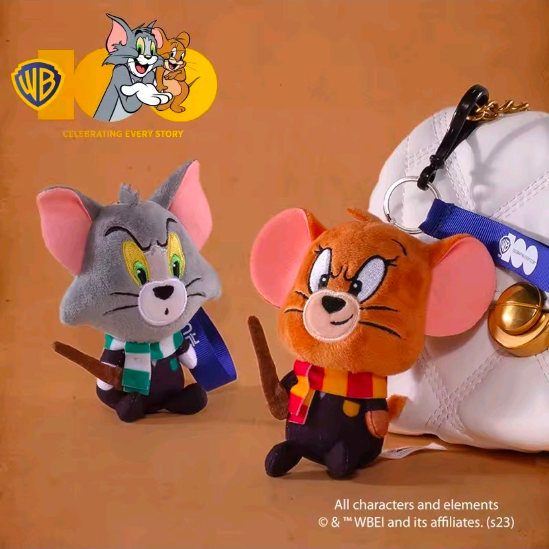 Orange and gray wizard plush keychains attached near a white sneaker strap