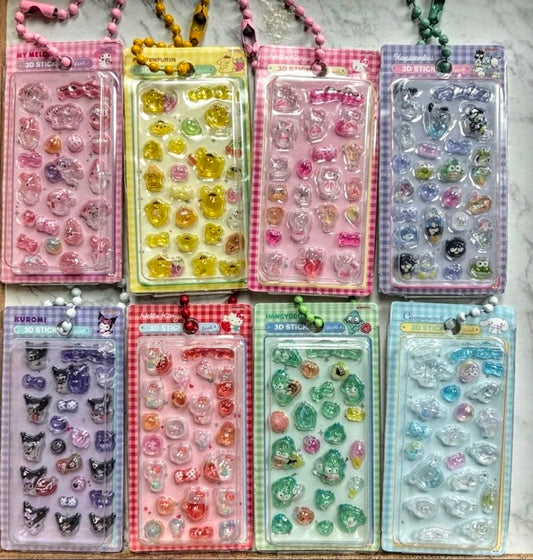 Assorted color 3D sticker keychains in blister packs arranged on a table