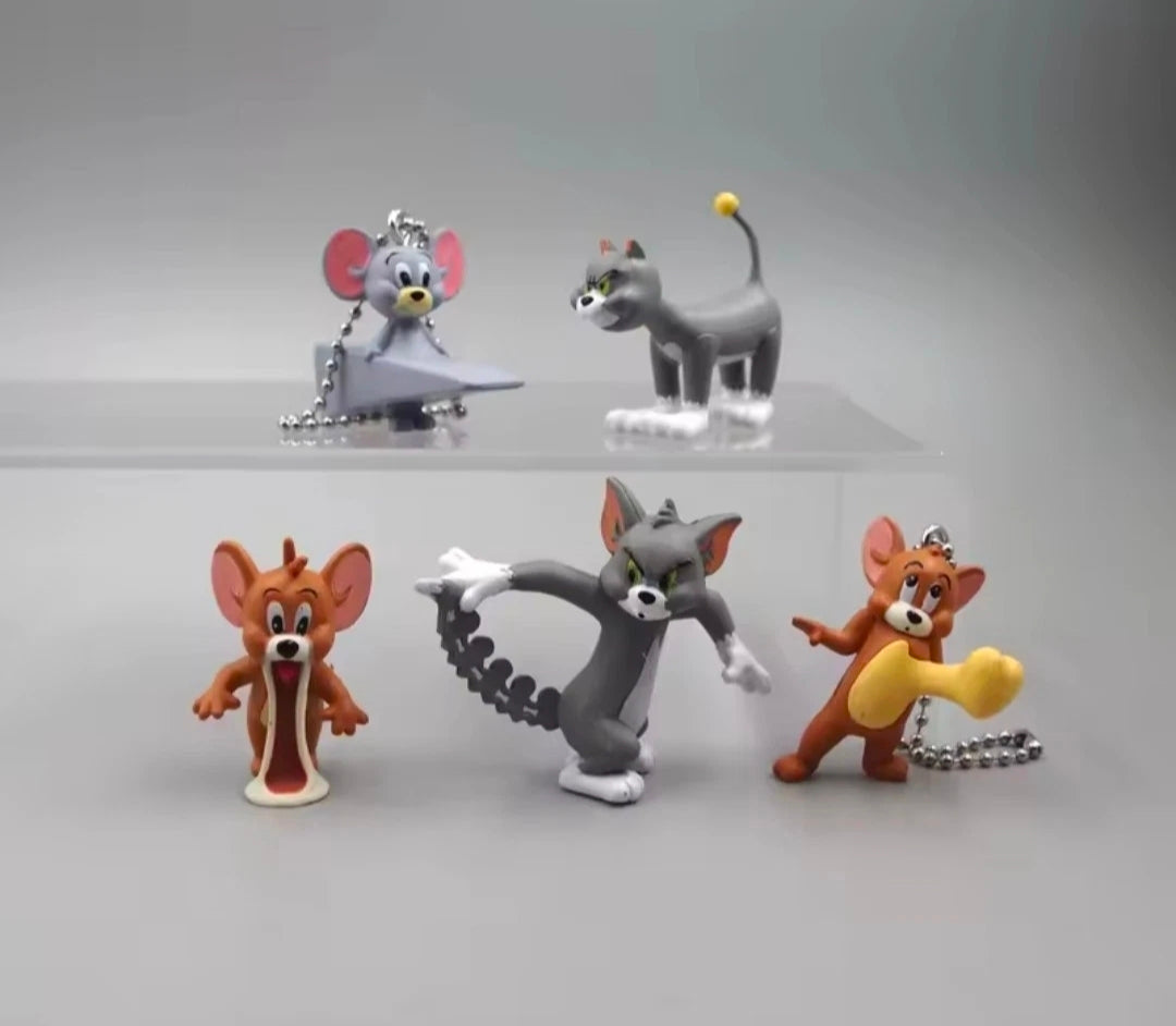 Five Tom and Jerry keychains featuring cat and mouse figures with attached metal chains