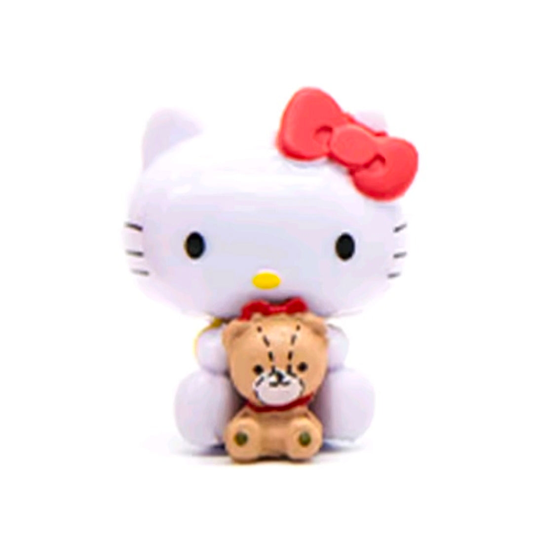 Hello Kitty mini figure holding a teddy bear accessory