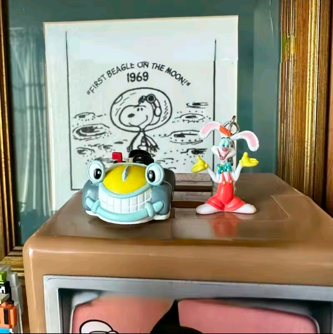 Benny Cab charm keychain display with cartoon rabbit figure and toy cab