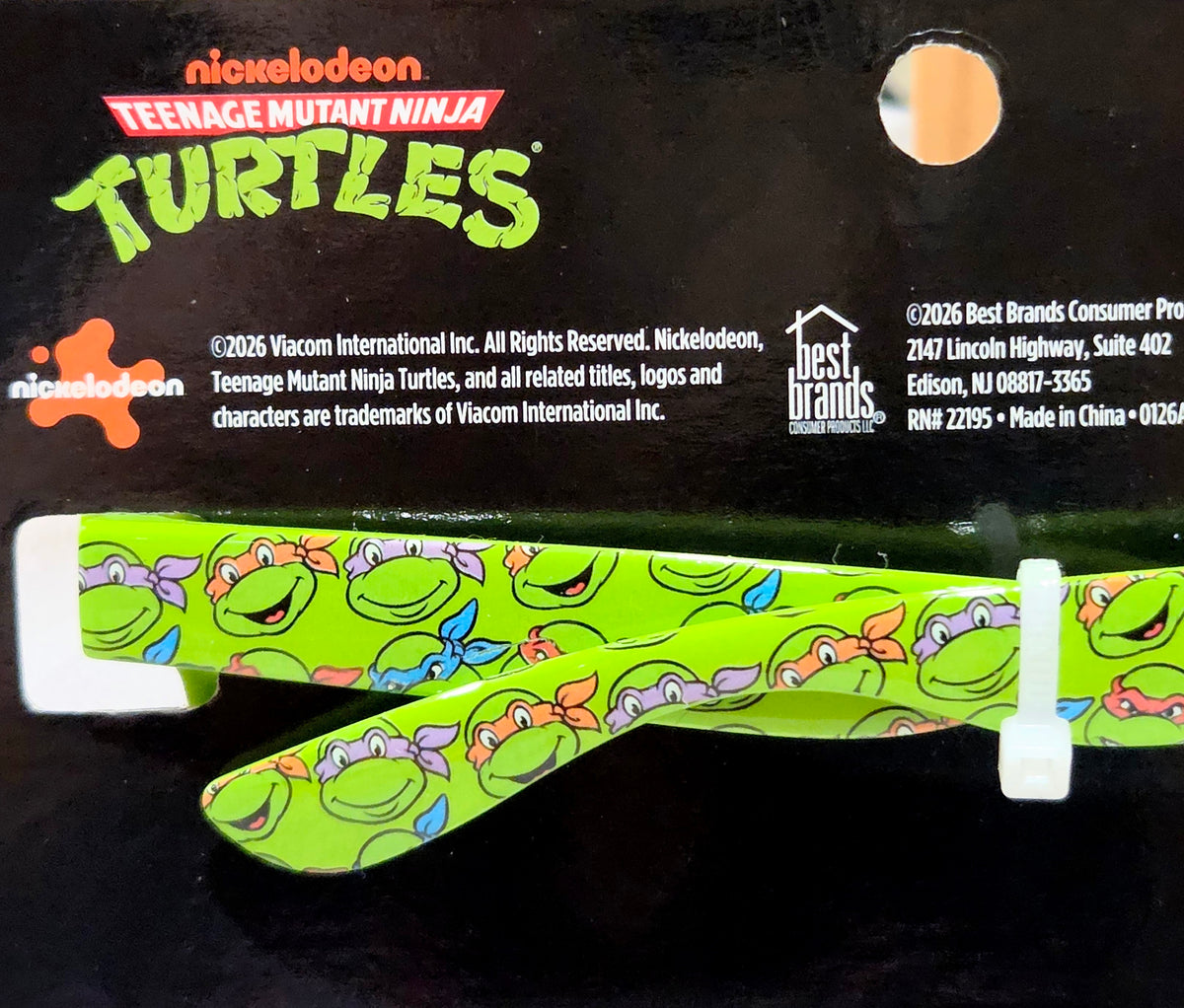 Teenage Mutant Ninja Turtles lip balm tube in green patterned wrapper