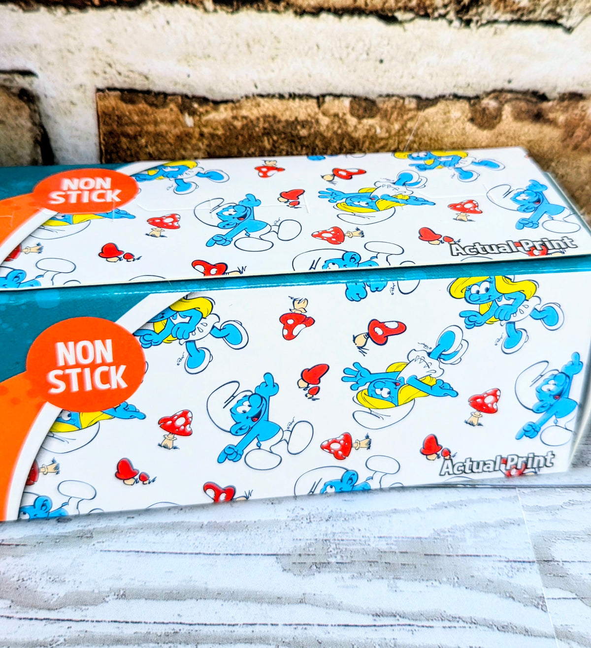 Smurfs baking liner sheet with non-stick label and small cartoon characters