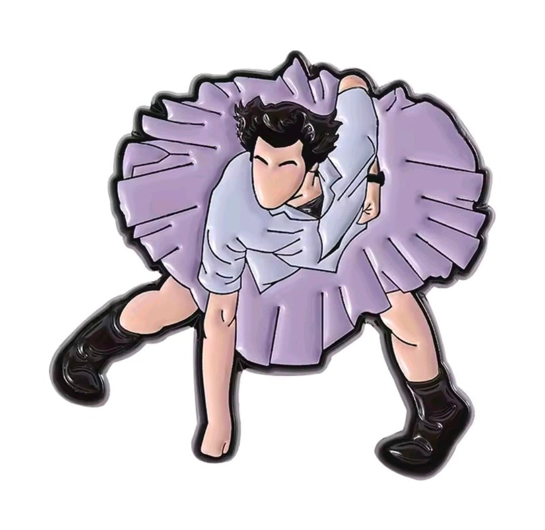 Enamel character pin with cartoon man in light purple shirt and ruffled cape