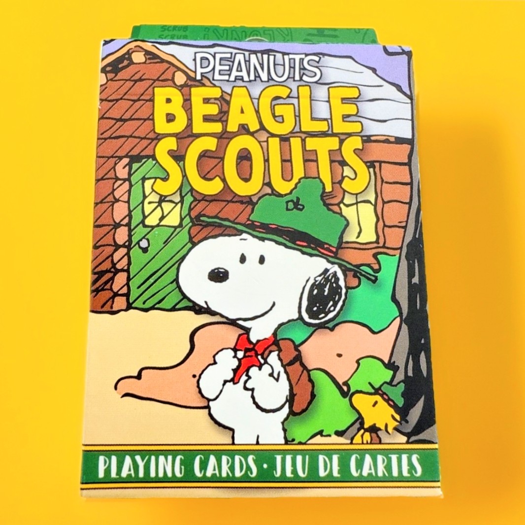 Beagle Scouts playing card deck box front with Snoopy in scout uniform illustration