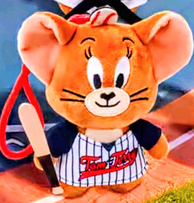 Orange mouse plush keychain close-up wearing blue jacket and pinstripe baseball jersey