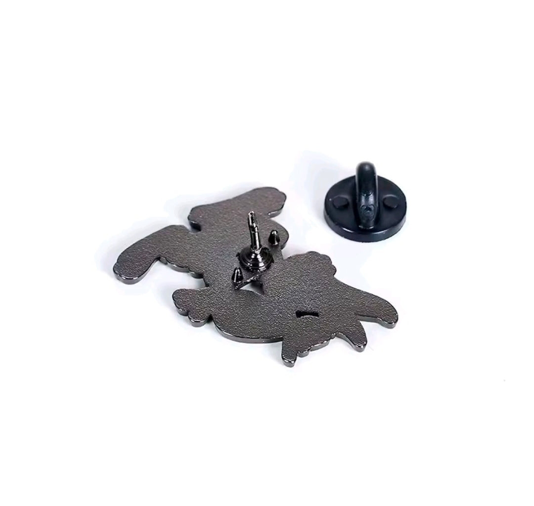 Enamel pin back view with dark metal post and clasp