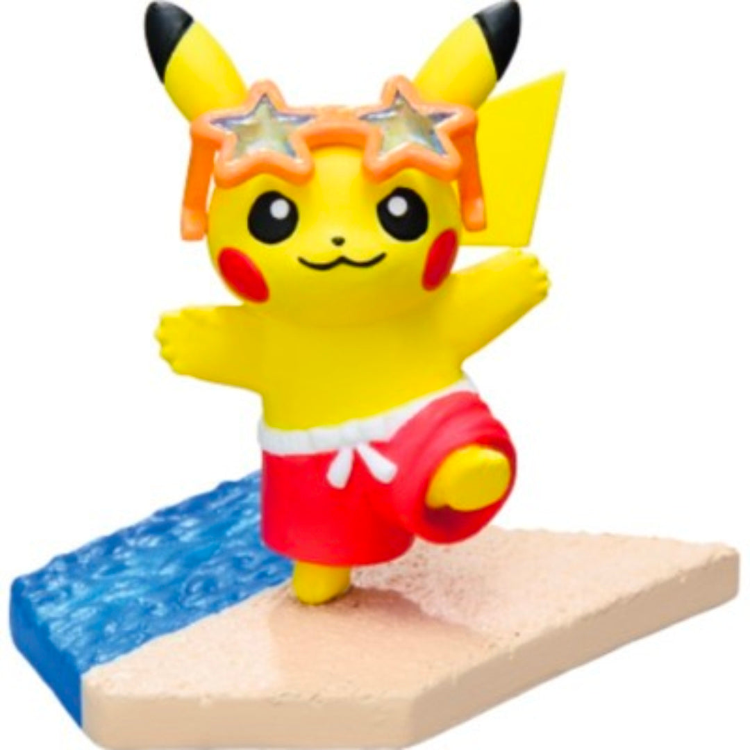 Seaside mini figure: yellow Pikachu wearing red swim shorts with star goggles near water