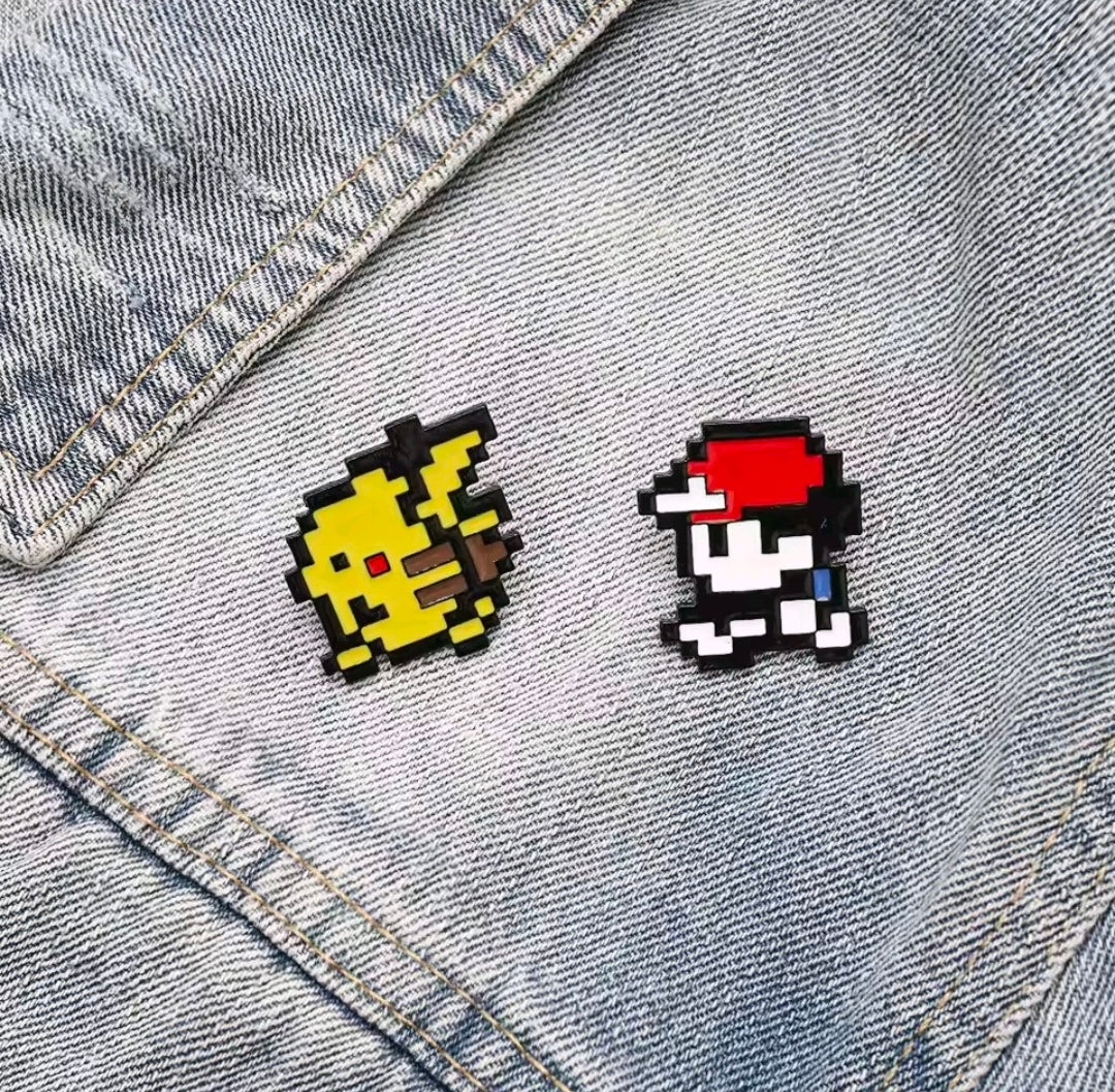 Pixel art Pikachu and trainer enamel pin set, 2 pieces