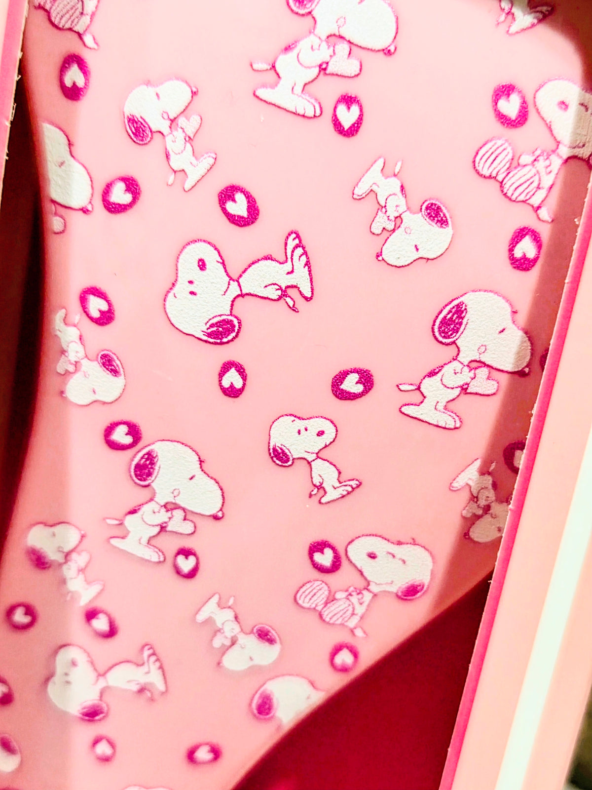 Pink hair detangler brush pad with Snoopy and heart decals