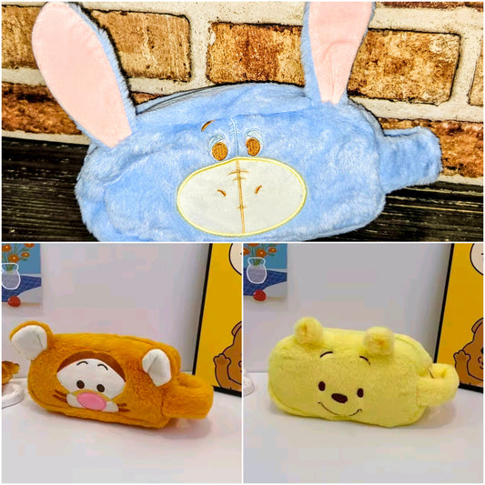 Blue plush zippered pouch with character face, long ears, and oval front patch