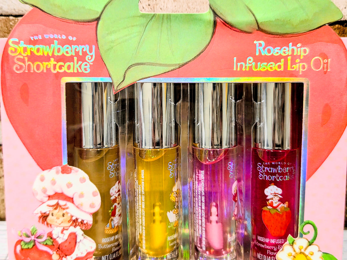 Rosehip infused lip oil gift pack showing four lip oil tubes