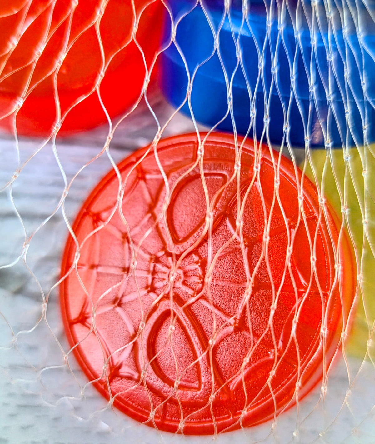 Red Spider-Man ice cube mold tray with round web-pattern cavities