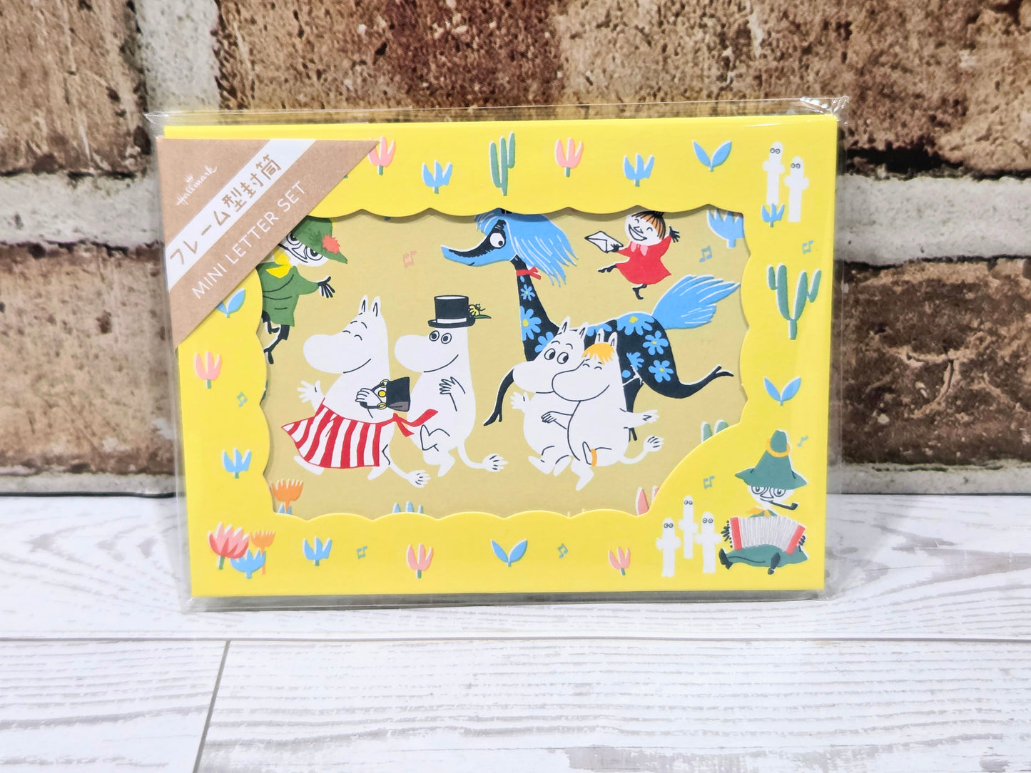 Yellow scalloped envelope with Moomin-style character mini notecard set, in clear wrap