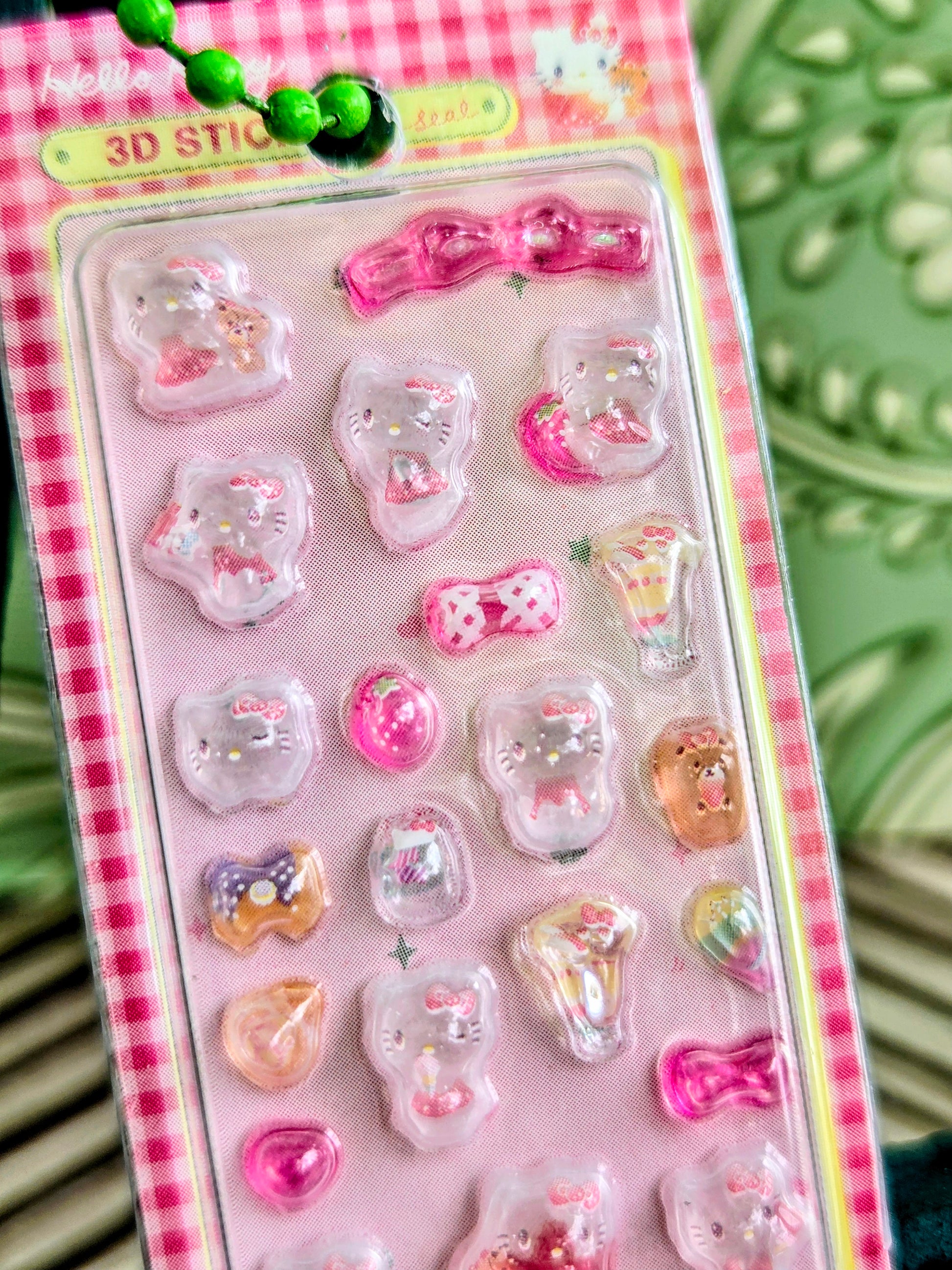 Pink blister pack of 3D character stickers on a sticker keychain card