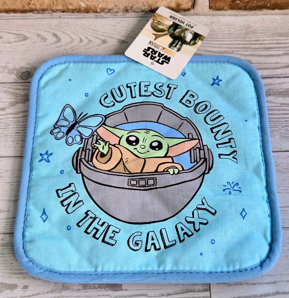 Light blue pot holder with Grogu in a helmet graphic