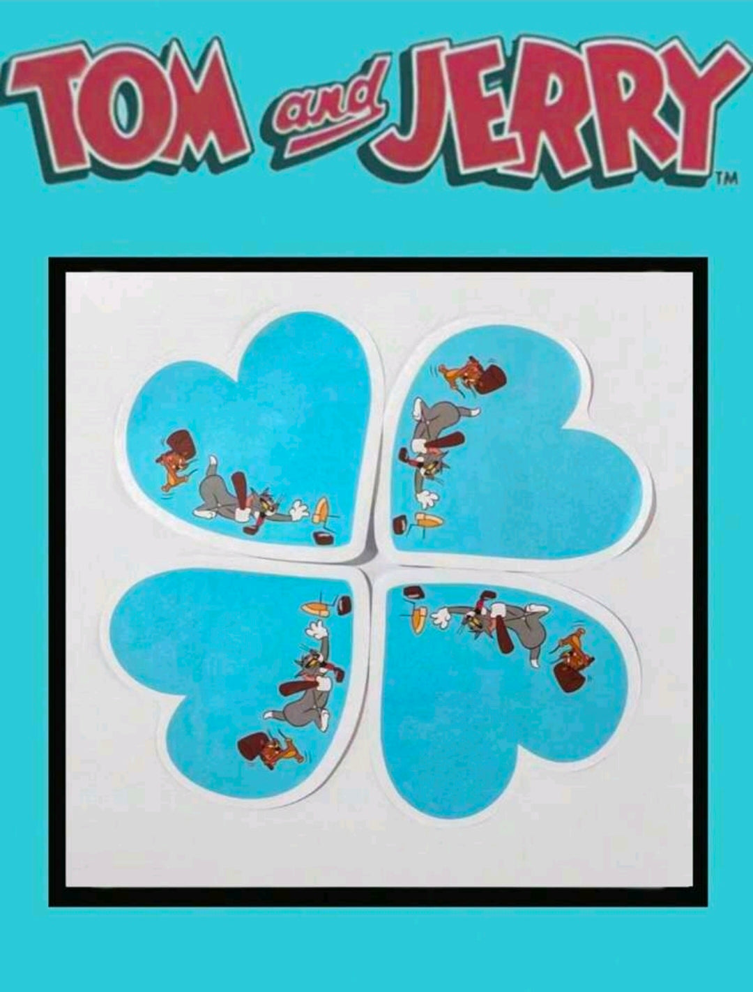 Blue heart-shaped sticky notes with Tom and Jerry character prints, arranged in a grid