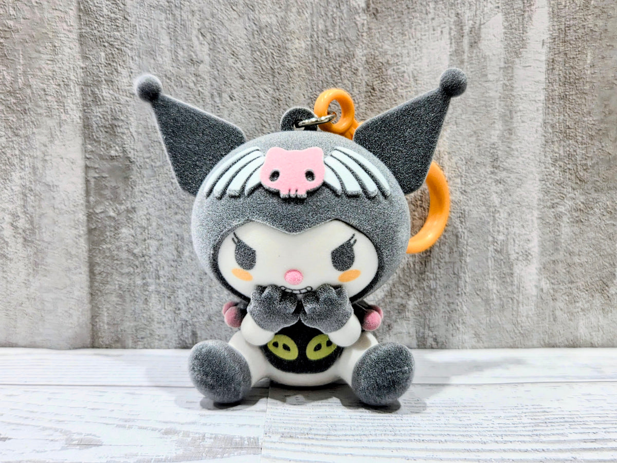 Gray flocked plush bag clip cat costume, orange loop, big wings, and smiling face with pumpkins