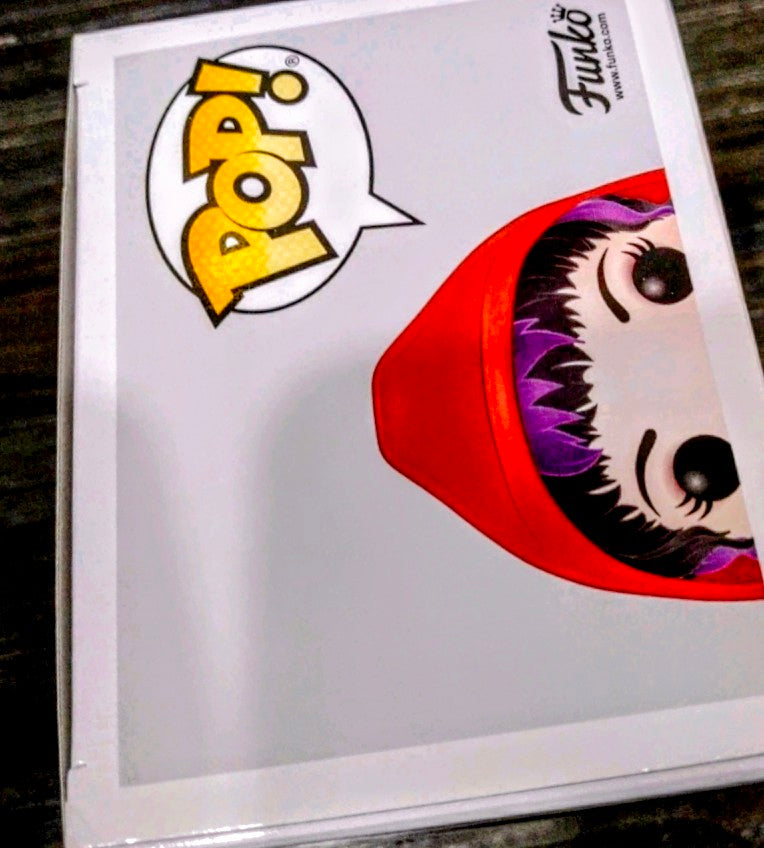 Funko Pop box side panel with stylized face graphic and red hood illustration